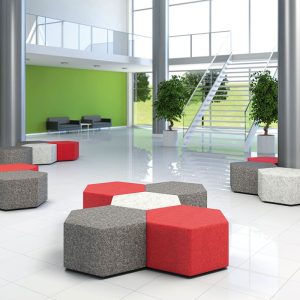 multi coloured hexagon poufs in a large room